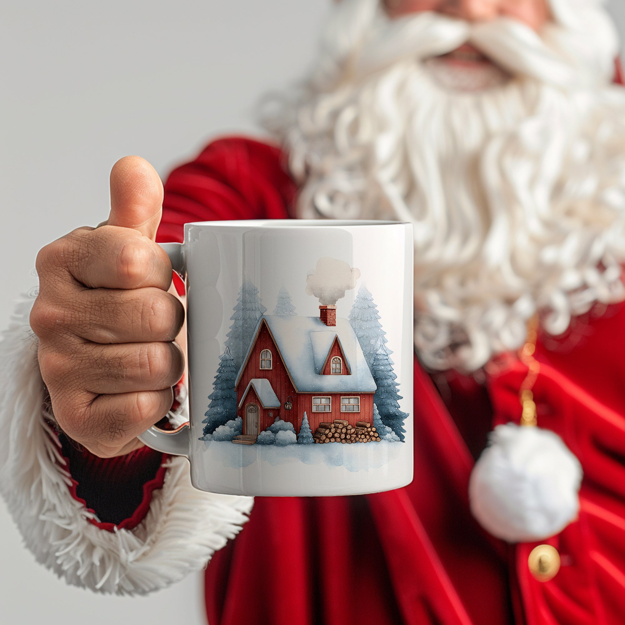 Weißer Becher mit rotem Haus und Tannenbaum-Motiv.