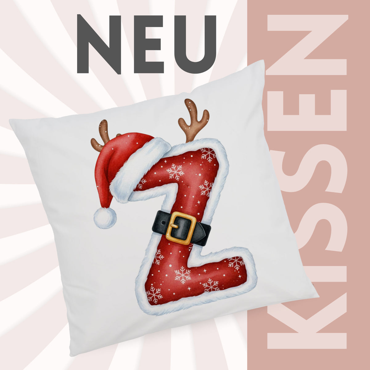 Weihnachtliches Kissen mit rotem Z, Schneeflocken und Geweihen.
