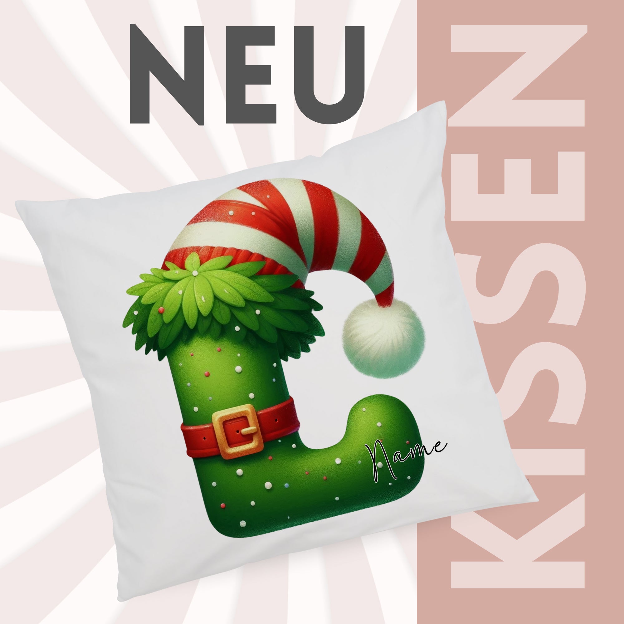 Grünes Kissen mit Weihnachtsmütze und personalisiertem Namen.