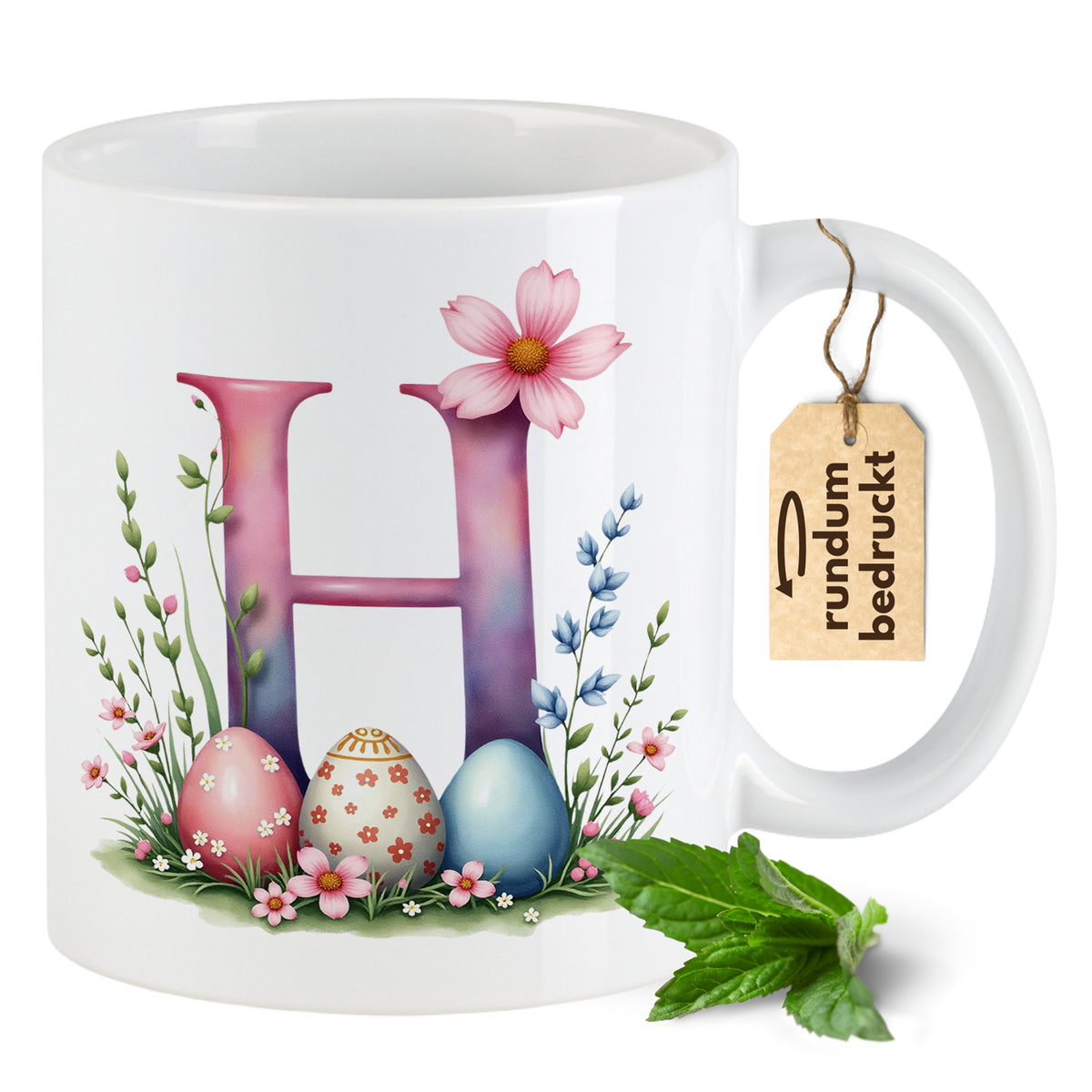 Kaffeetasse mit buntem "H", Ostereiern und Blumen.