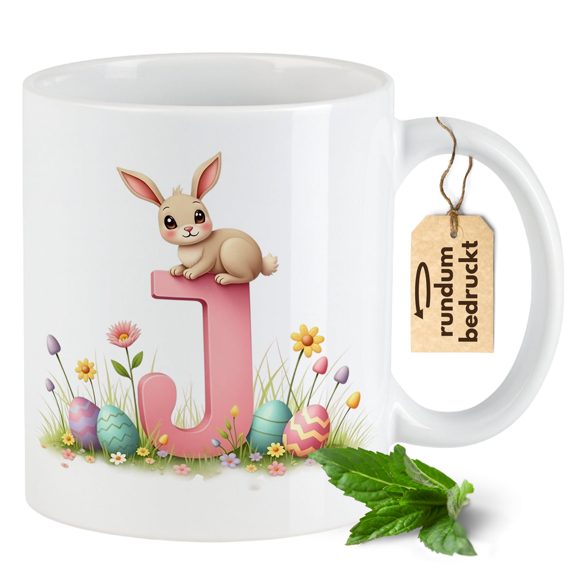 Tasse mit Hase, pinkem Buchstaben J und bunten Eiern.