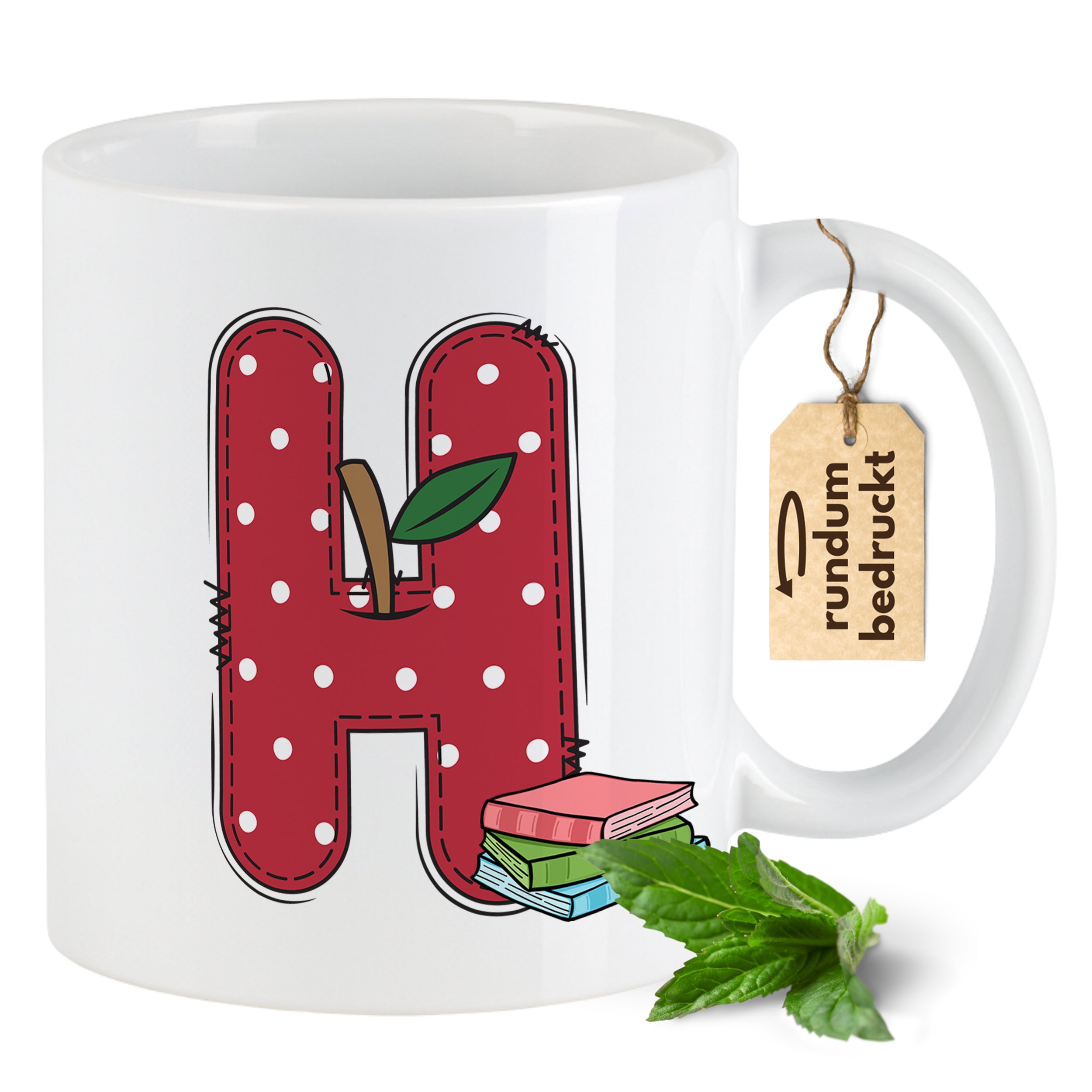 Tasse in Weiß mit rotem Buchstaben H und grüner Pflanze.