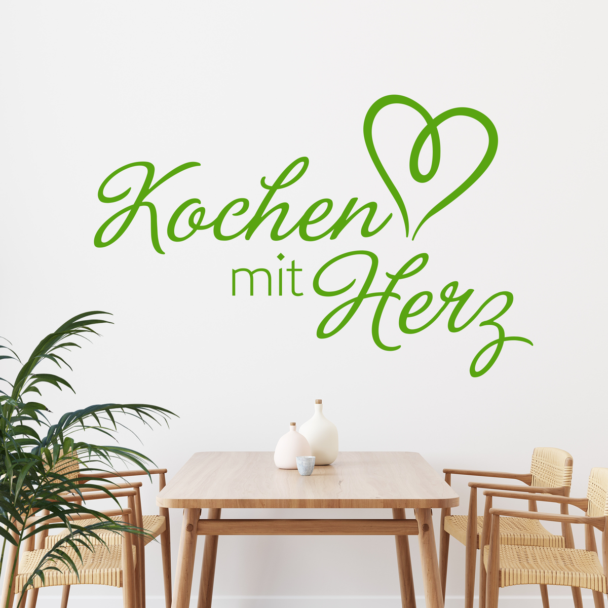 Grüner Wandaufkleber "Kochen mit Herz" in modernem Schriftzug.