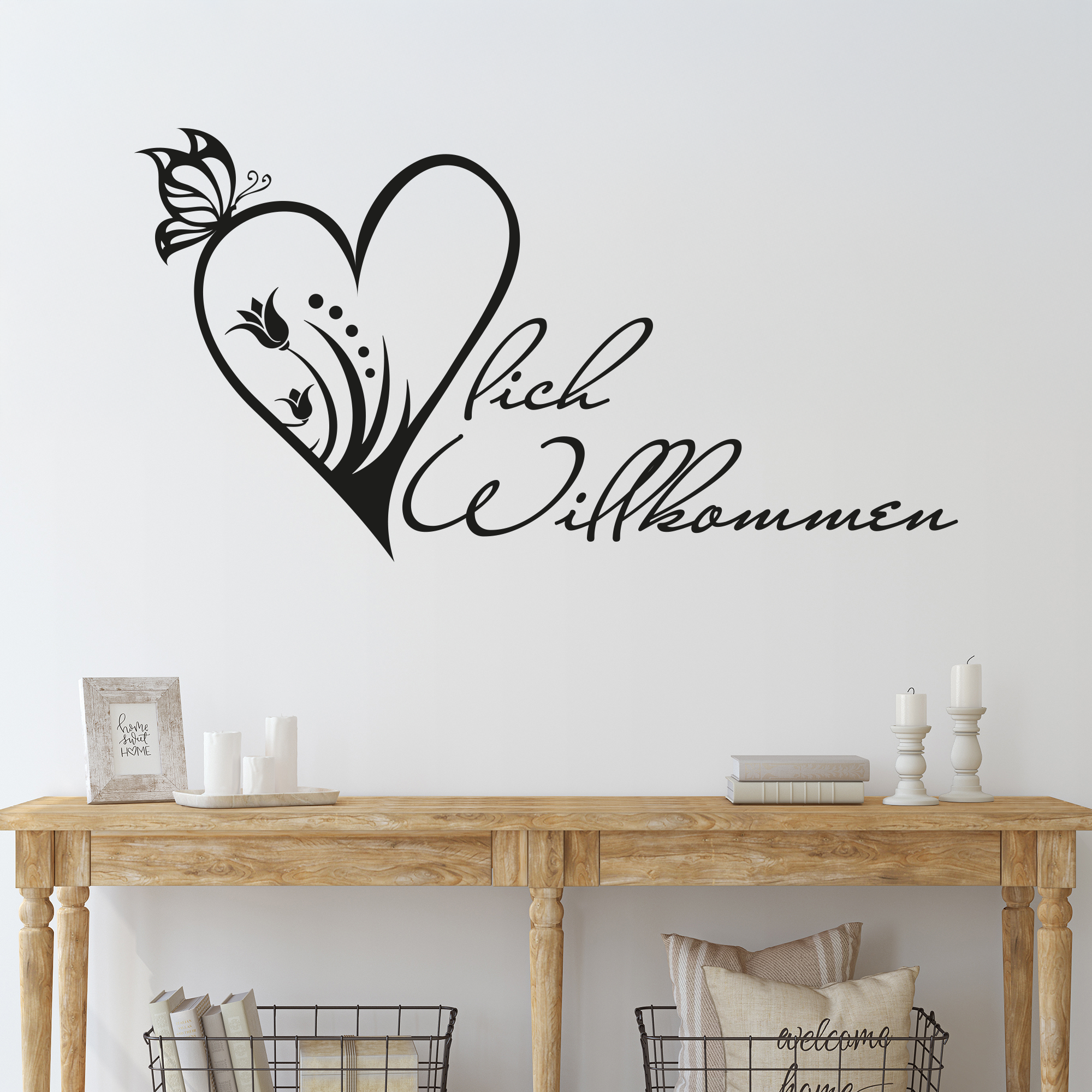 Wandtattoo in Schwarz mit Herz und "Willkommen" Schriftzug.