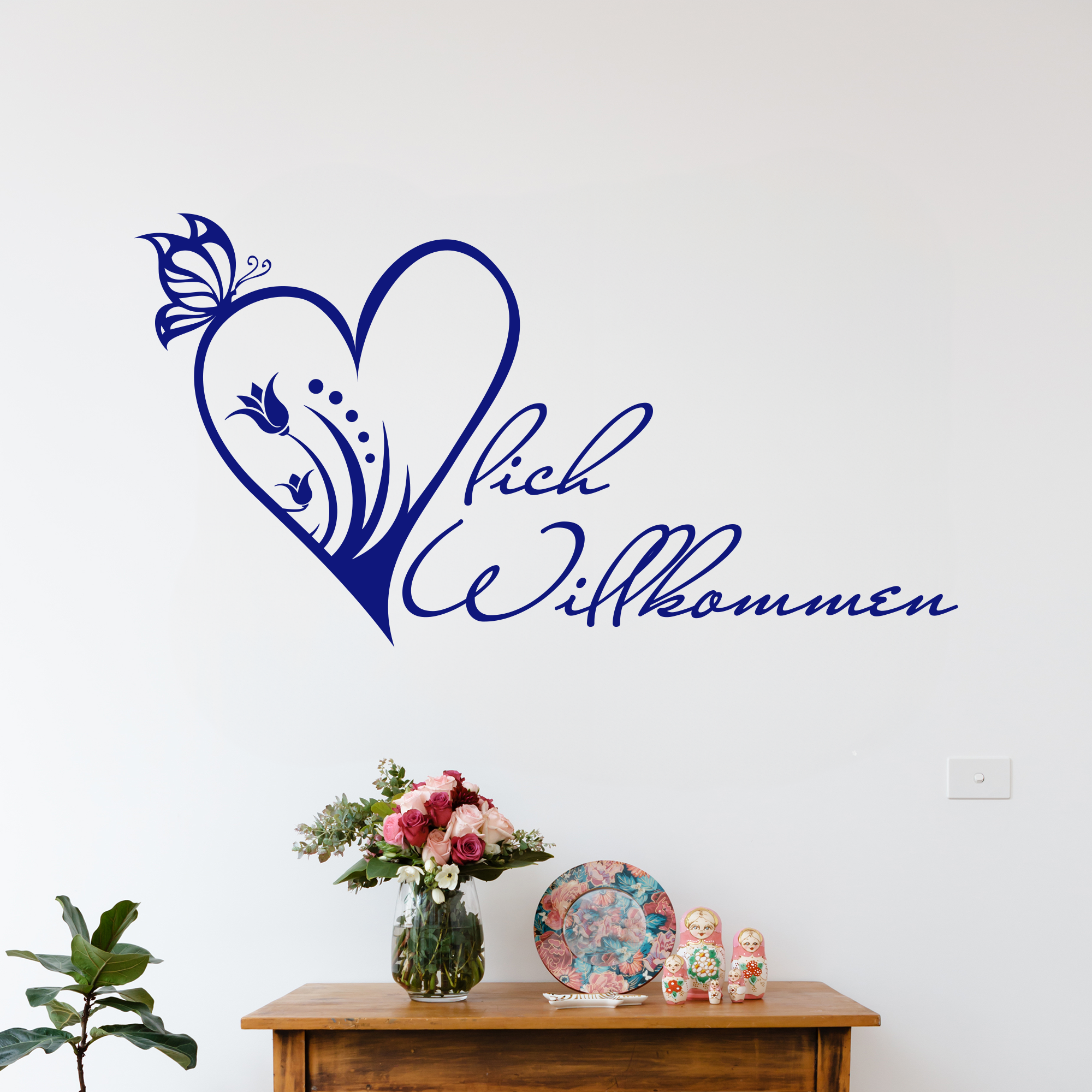 Wandtattoo in Blau mit Herz und Willkommensschrift.