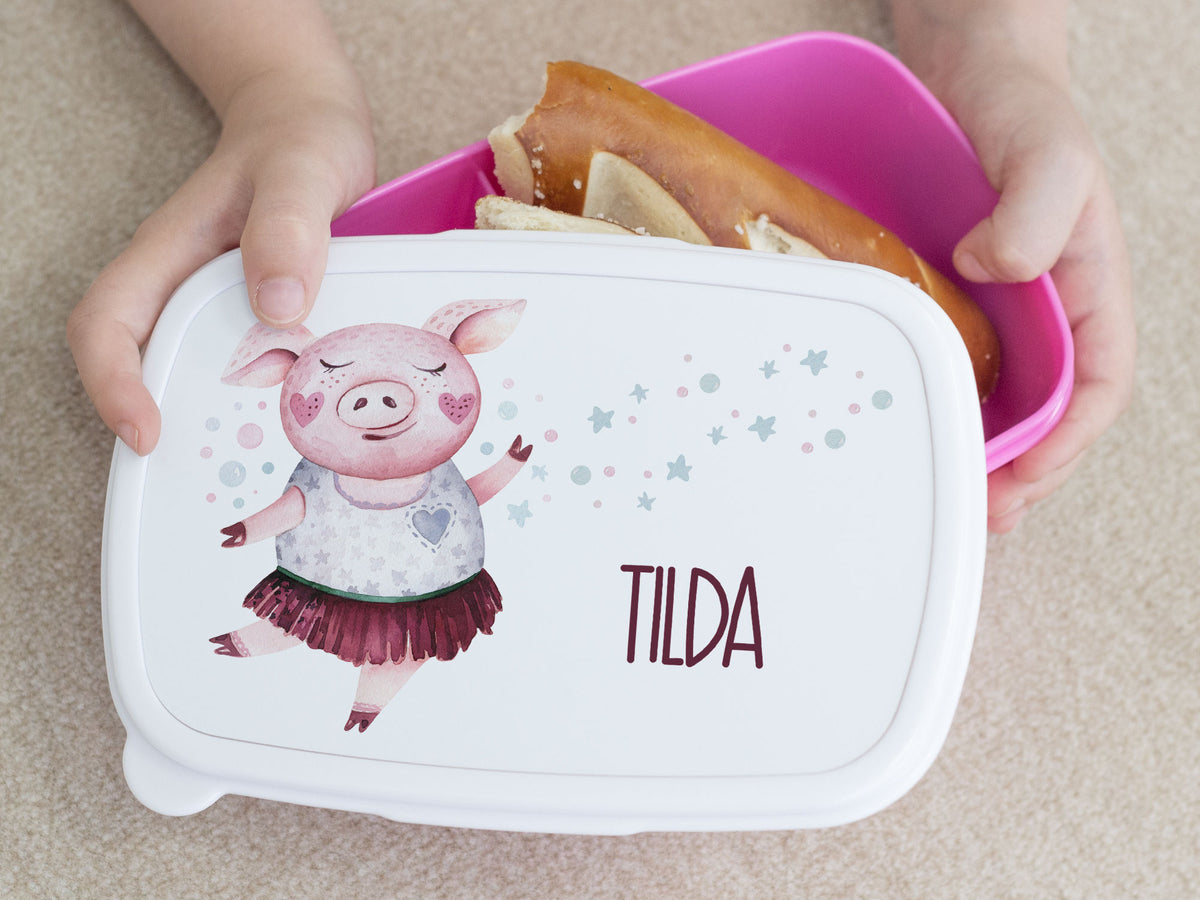 Bento-Box mit rosa Schweinchen-Motiv und dem Namen TILDA.