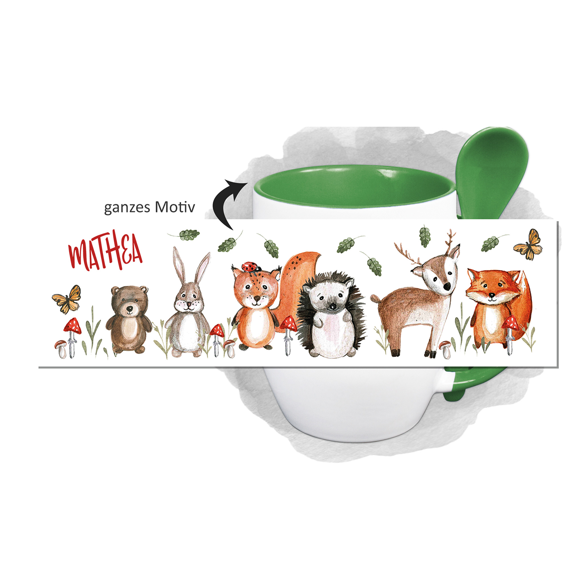 Tasse mit buntem Tiermotiv und grünem Henkel.
