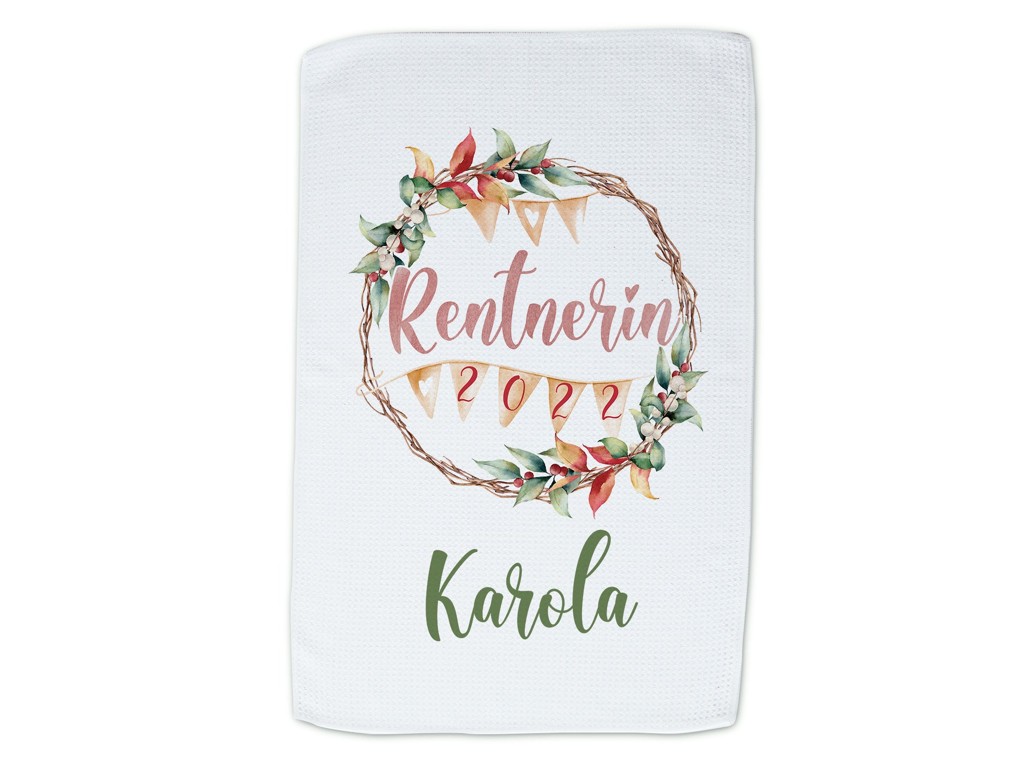 Handtuch mit floralem Rentenmotiv in Weiß und Grün.