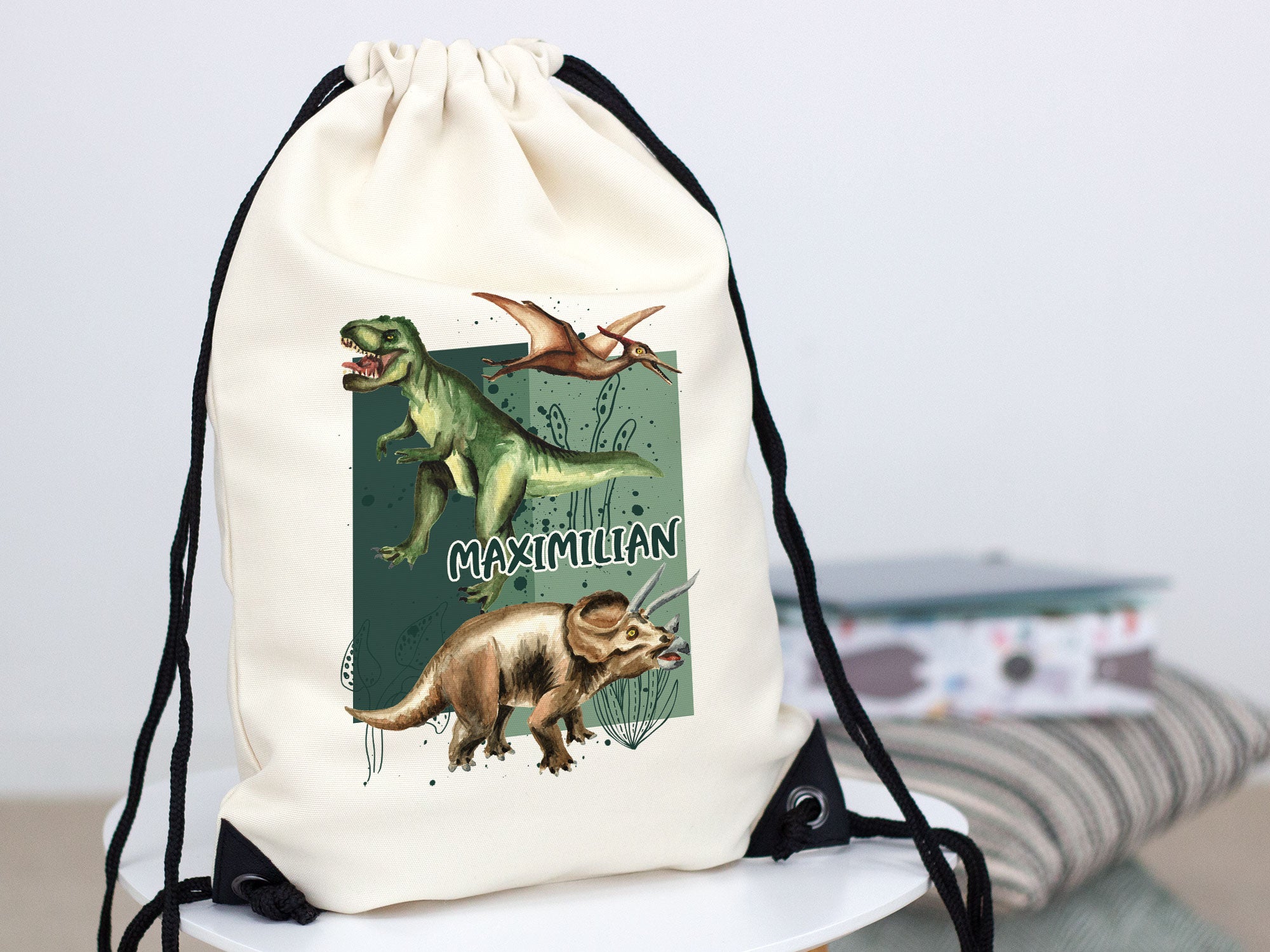 Beige Turnbeutel mit Dinosaurier-Motiv und Namen "Maximilian".