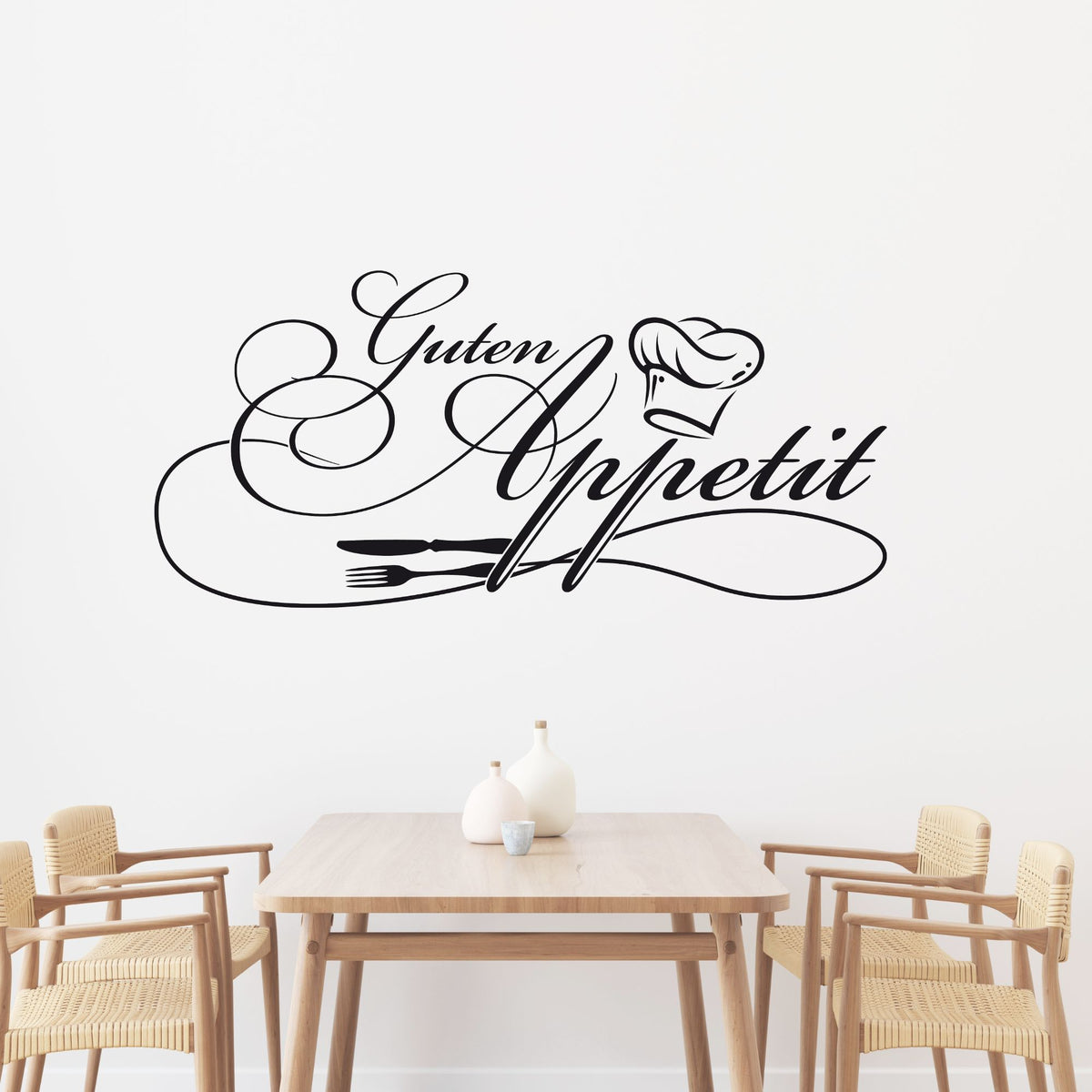 Wandtattoo "Guten Appetit" in Schwarz mit Kochmütze und Besteck.