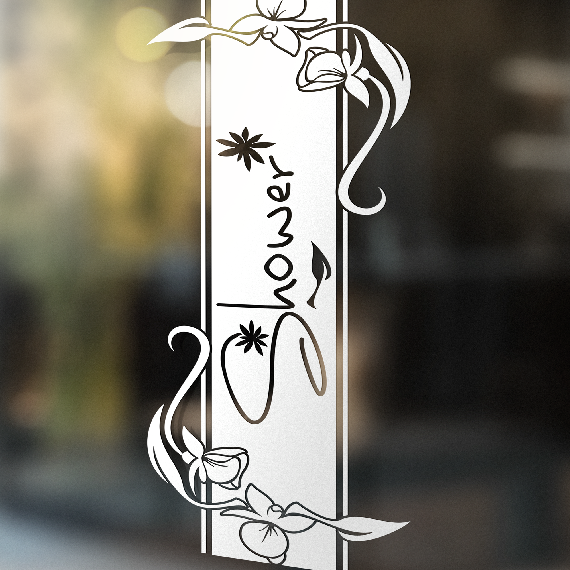 Dekoratives Duschschild mit floralen Motiven in Schwarz.