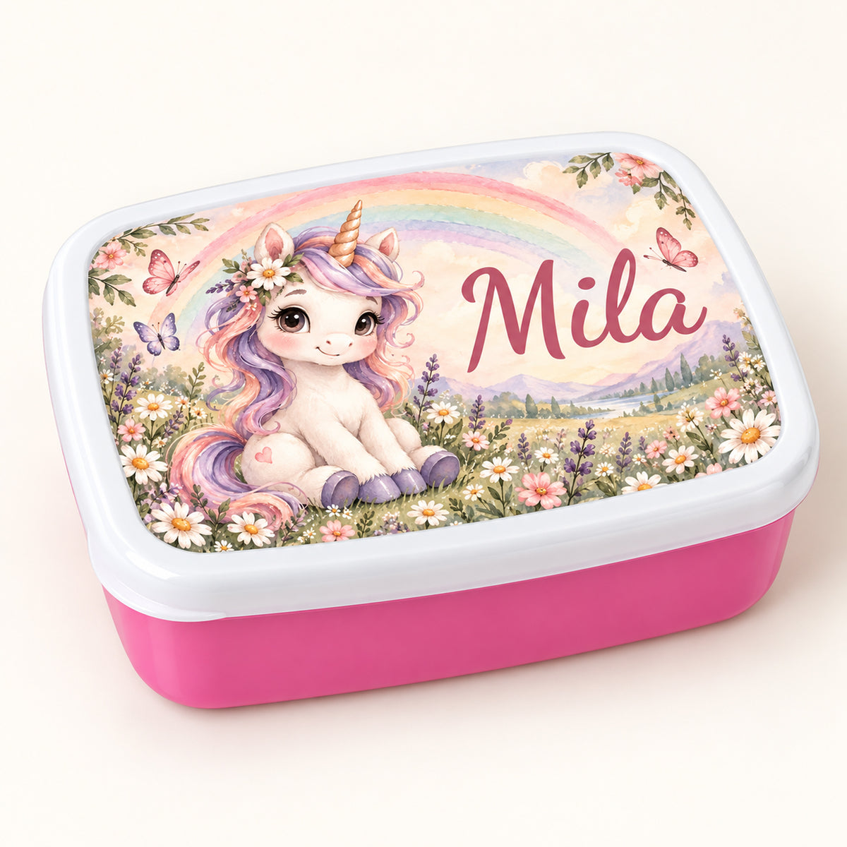 Personalisierte rosa Brotdose Einhorn im Regenbogengarten mit Beispielname Mila: Hauptbild