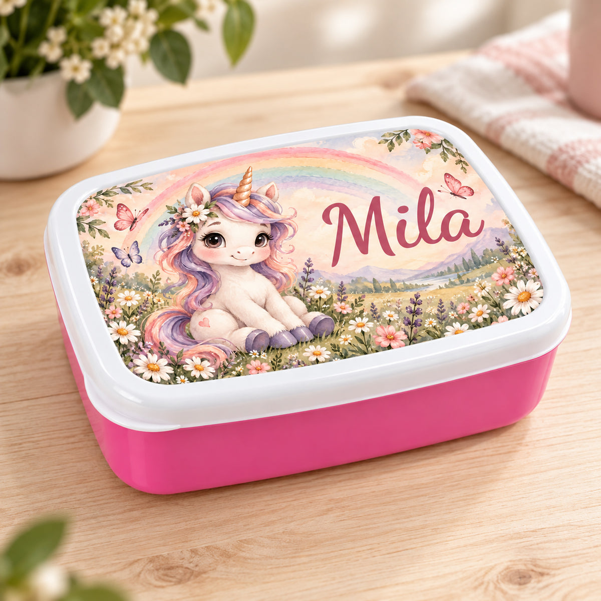 Personalisierte rosa Brotdose Einhorn im Regenbogengarten mit Beispielname Mila: Schrägansicht