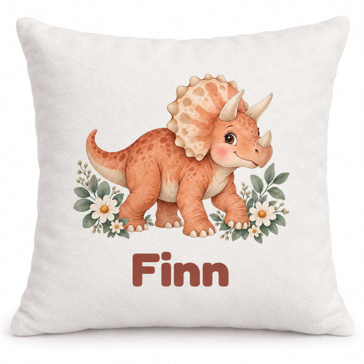 Personalisierter Dino-Kissenbezug: Triceratops mit Blumen, Beispielname Finn – Produktfoto auf weißem Hintergrund
