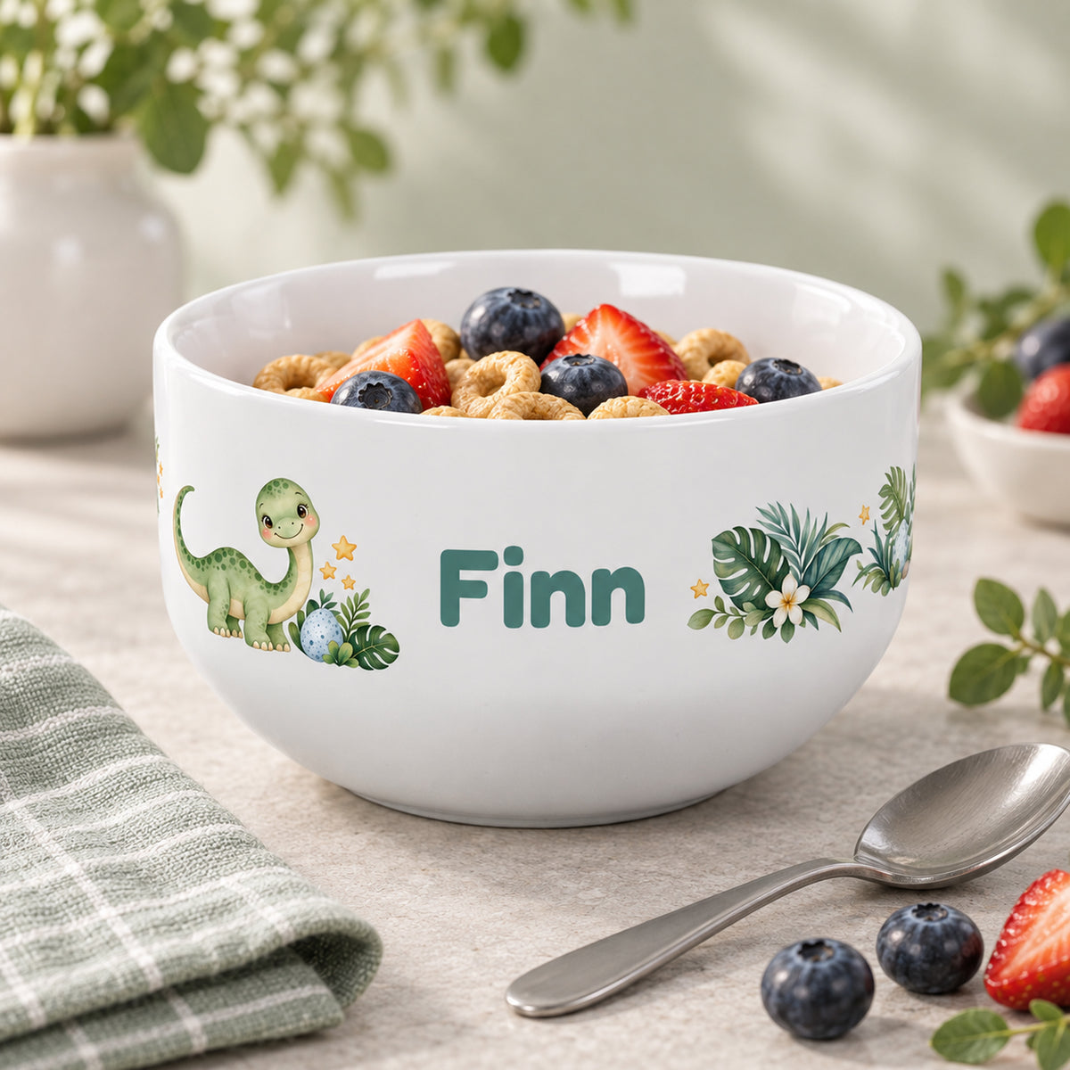 Frühstücksszene mit der Müslischale Dino und Beispielname Finn
