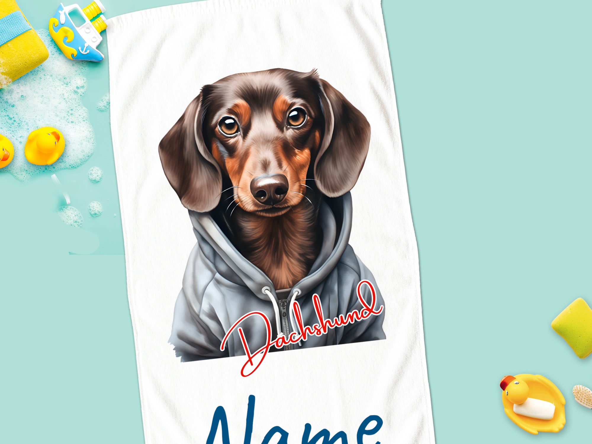 Dackel in grauem Hoodie mit personalisierbarem Namen.