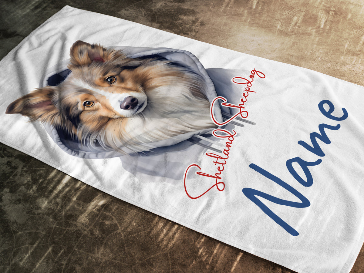 Weißes Handtuch mit Collie-Motiv und personalisiertem Namen.