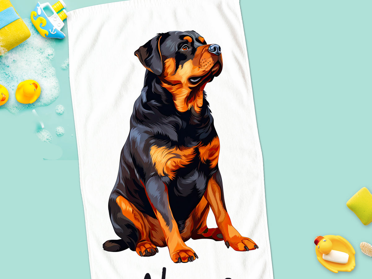 Rottweiler auf einem weißen Handtuch, schwarz-orange Farben.