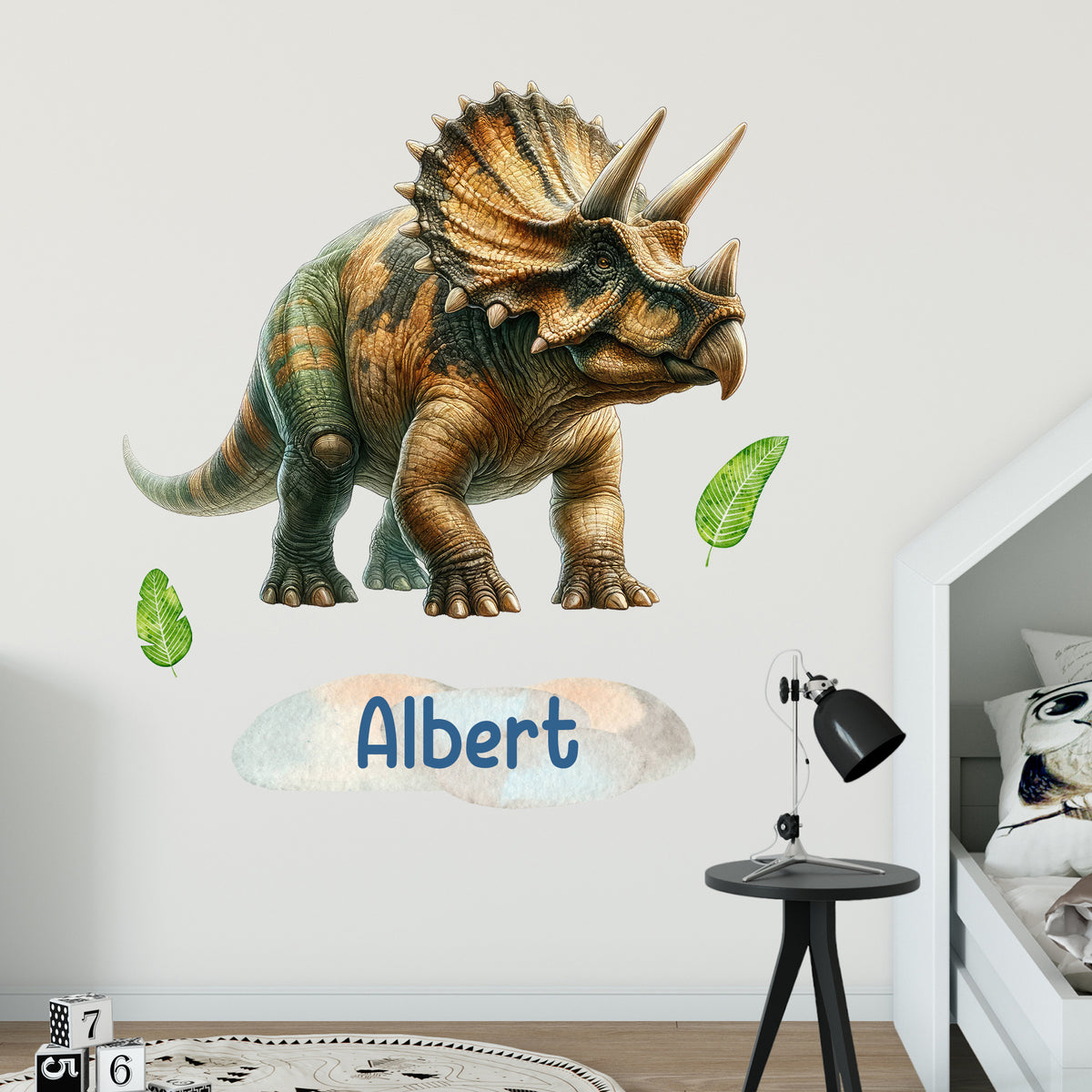Wandtattoo mit Triceratops und Wunschname im Kinderzimmer