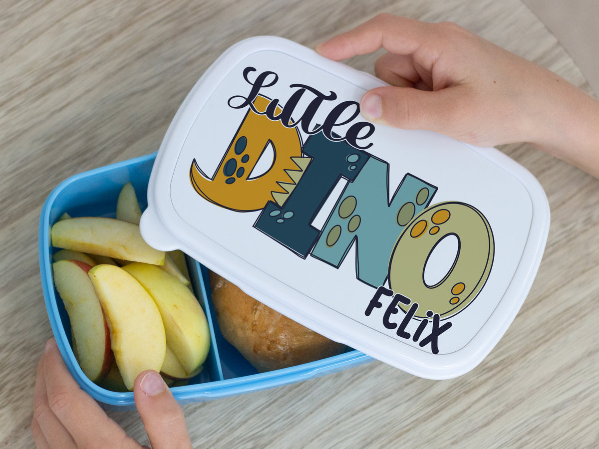 Bunte Brotdose mit "Little Dino" und Äpfeln.