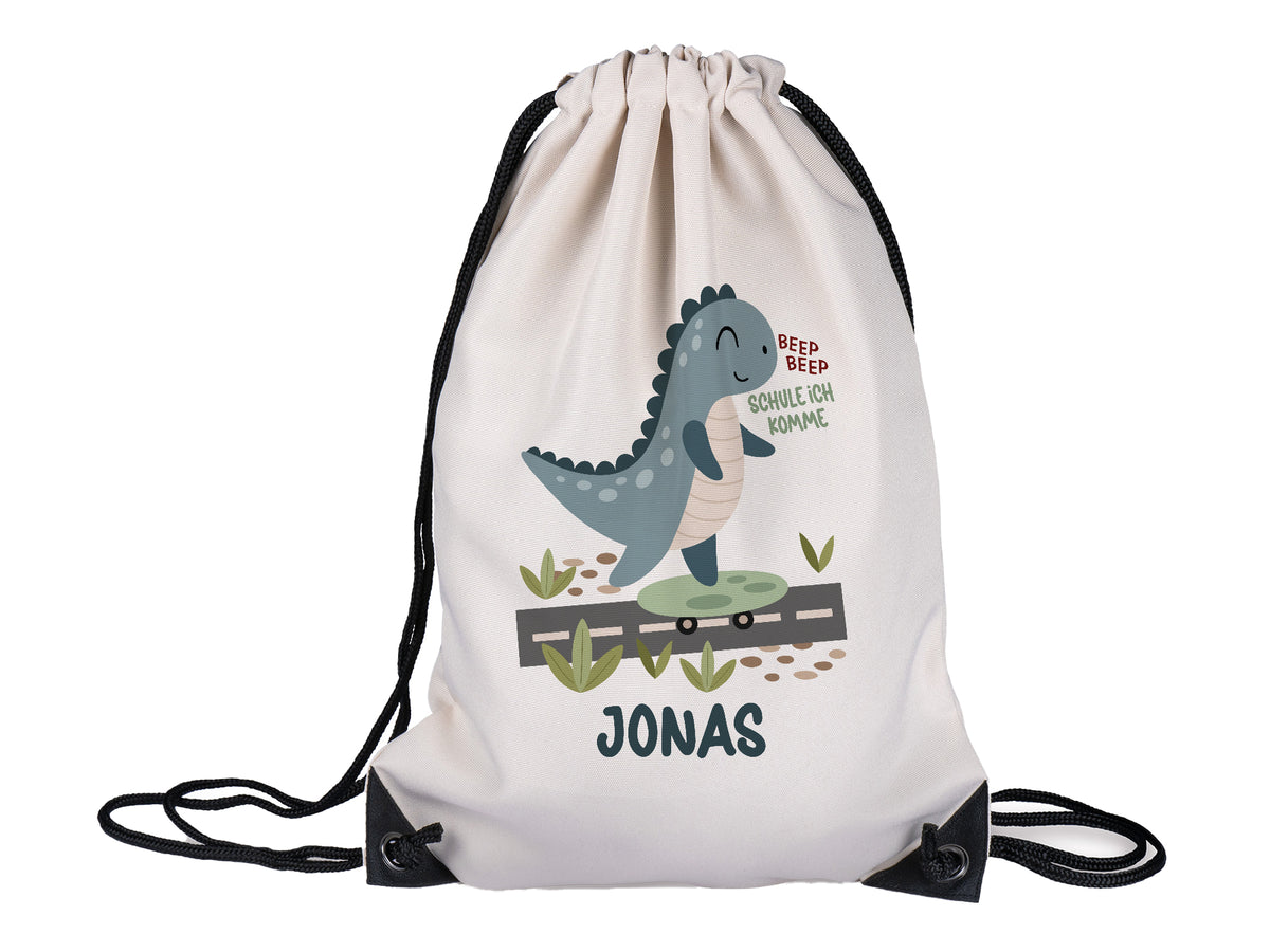 Beige Turnbeutel mit Dinosaurier-Motiv und Name Jonas.