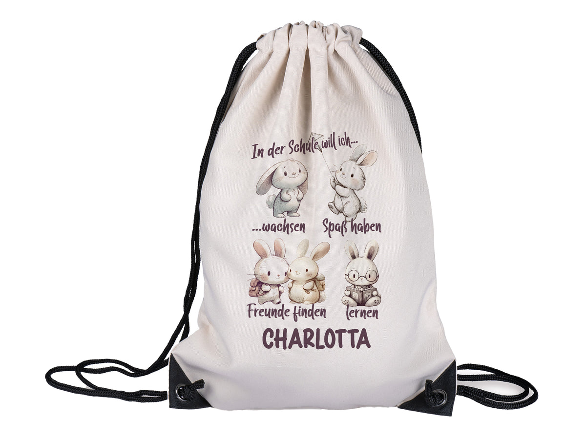 Beige Turnbeutel mit Hasenmotiven und Text für Kinder.