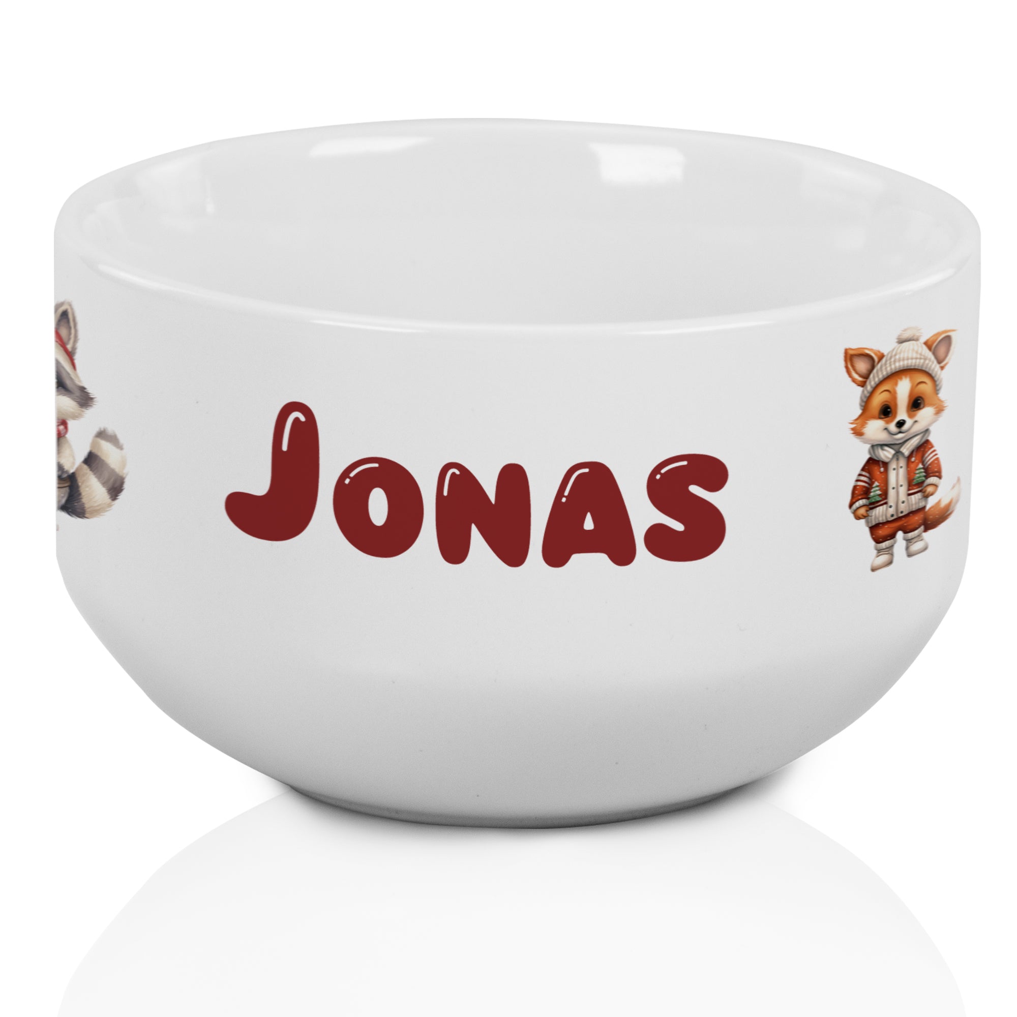 Weiße Schüssel mit personalisiertem Namen "JONAS" und Tiermotiven.