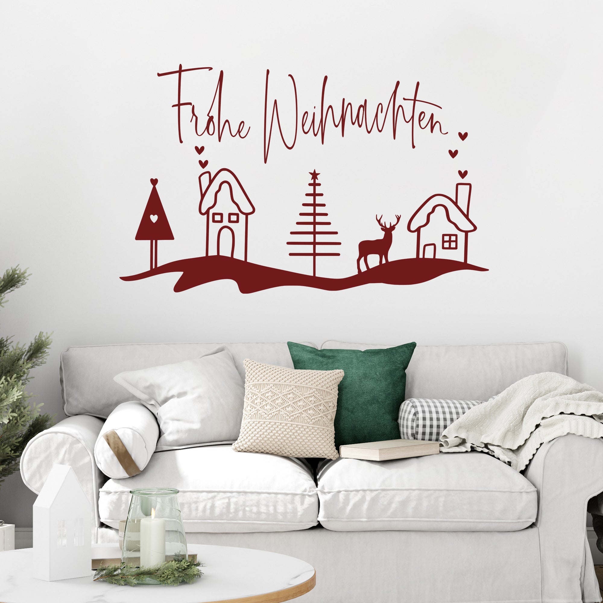 Frohe Weihnachten Wanddeko in Rot mit Häusern und Tannen.