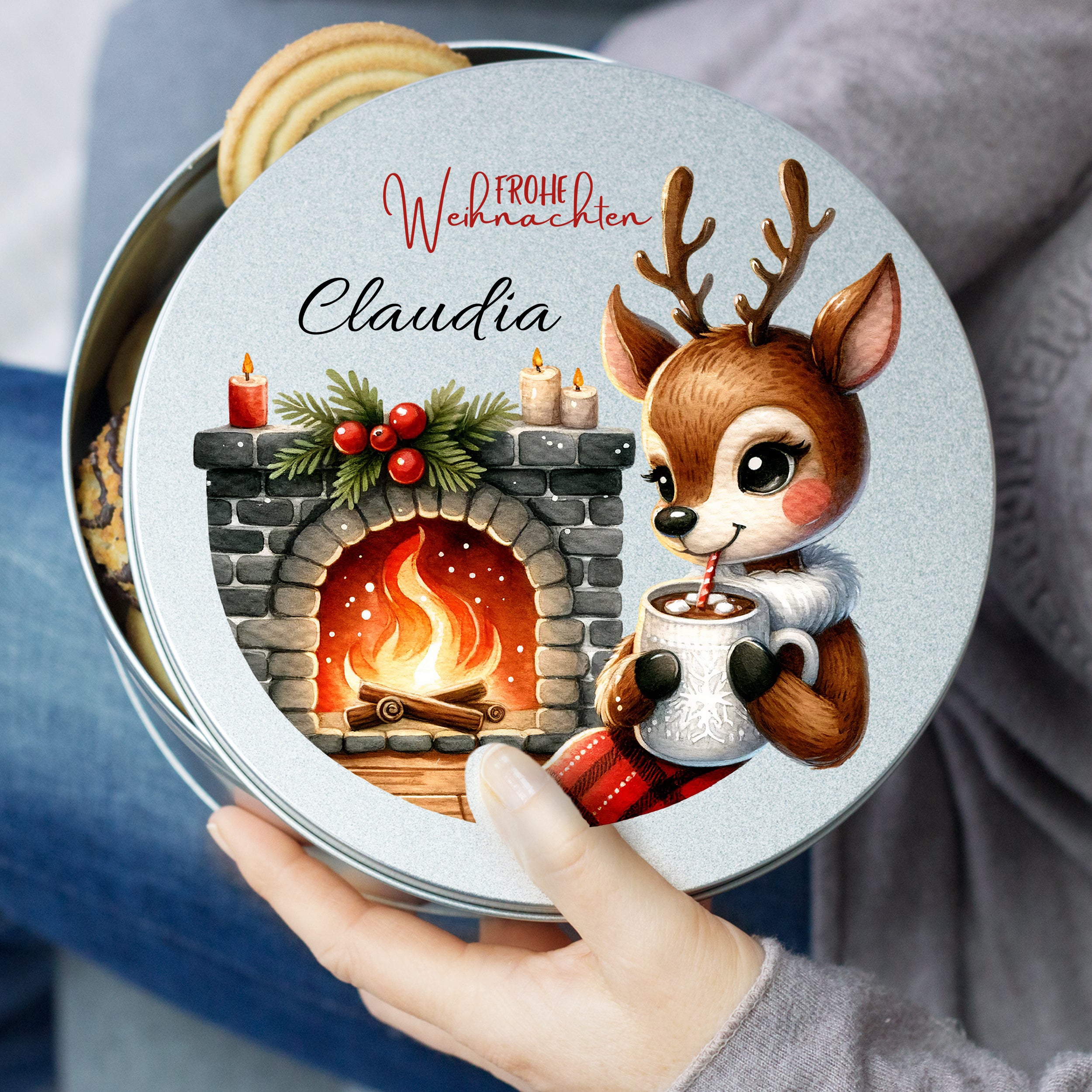 Runder Keksdose mit Weihnachtsmotiv und Reh-Illustration.
