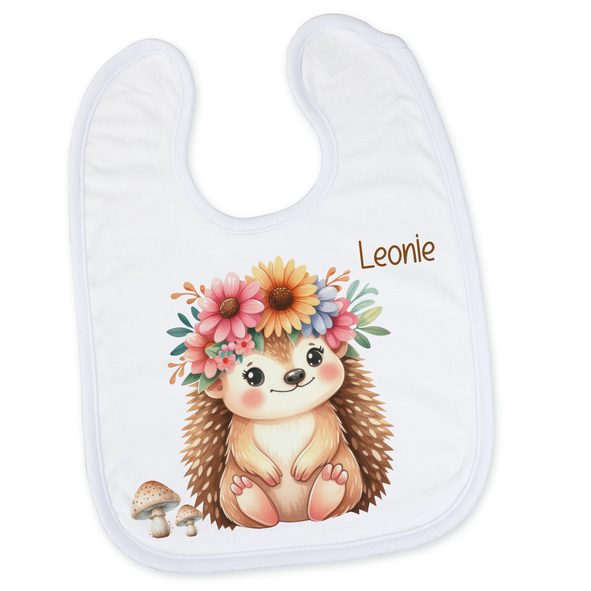 Weißes Lätzchen mit Igel-Motiv und bunten Blumen.