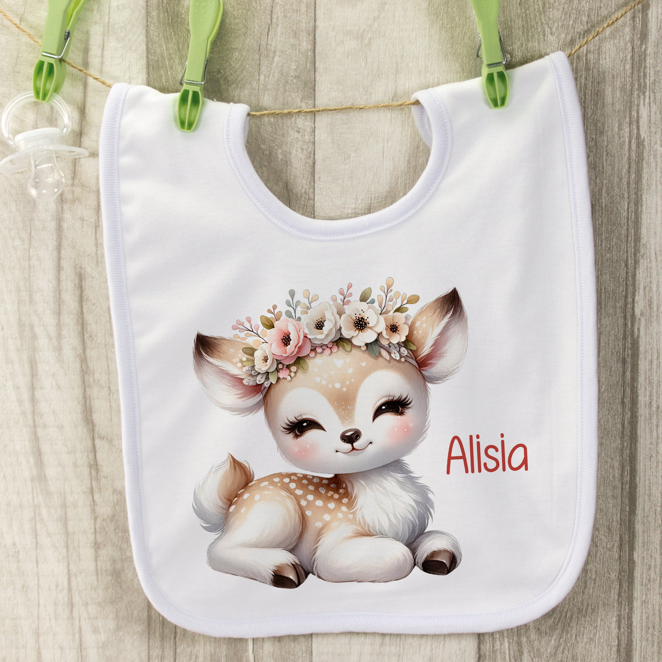 Lätzchen mit niedlichem Reh-Motiv und Blumenkranz, personalisiert.