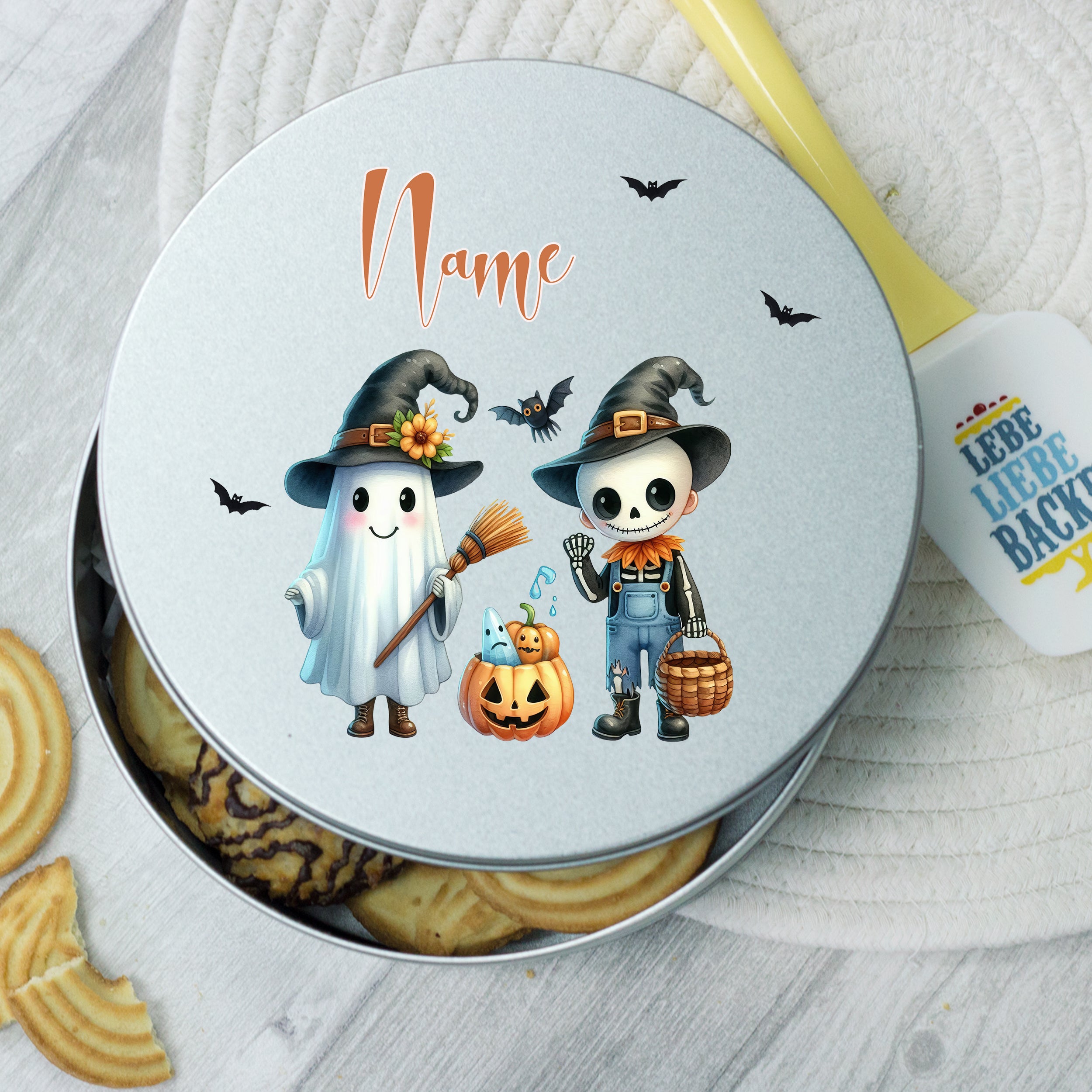 Geschenkdose mit Gespenst und Skelett, silberfarben, Halloween-Motiv.