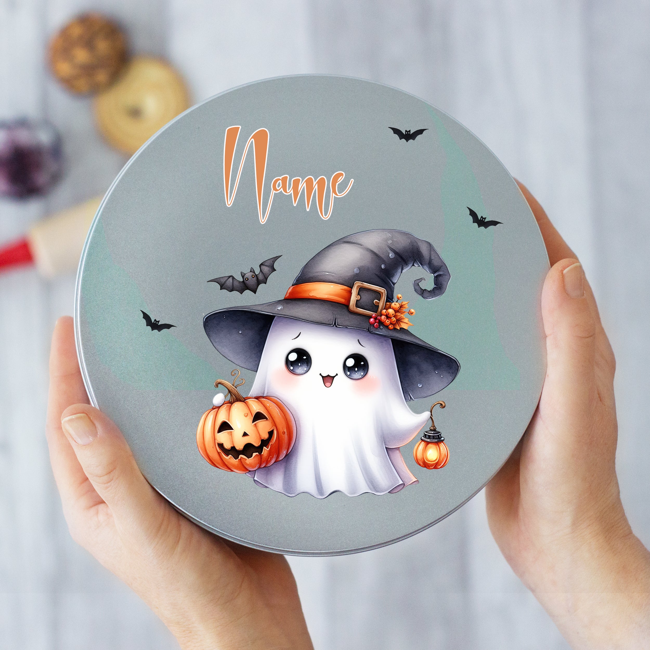 Gruselige Geisterdose mit Halloween-Motiv, grau und orange.
