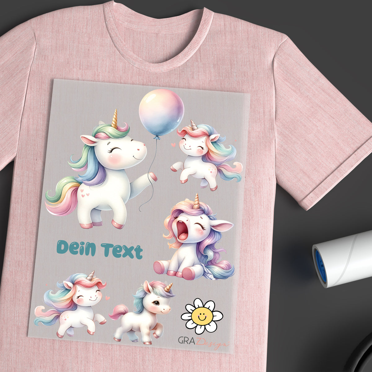 Rosa T-Shirt mit bunten Einhörnern und Text.