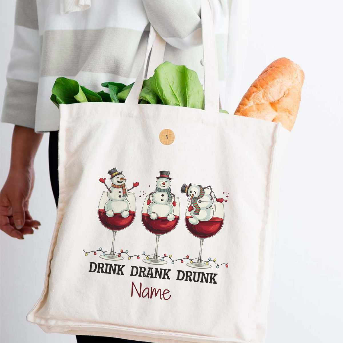 Stofftasche mit Schneemännern und rotem Weinmotiv.