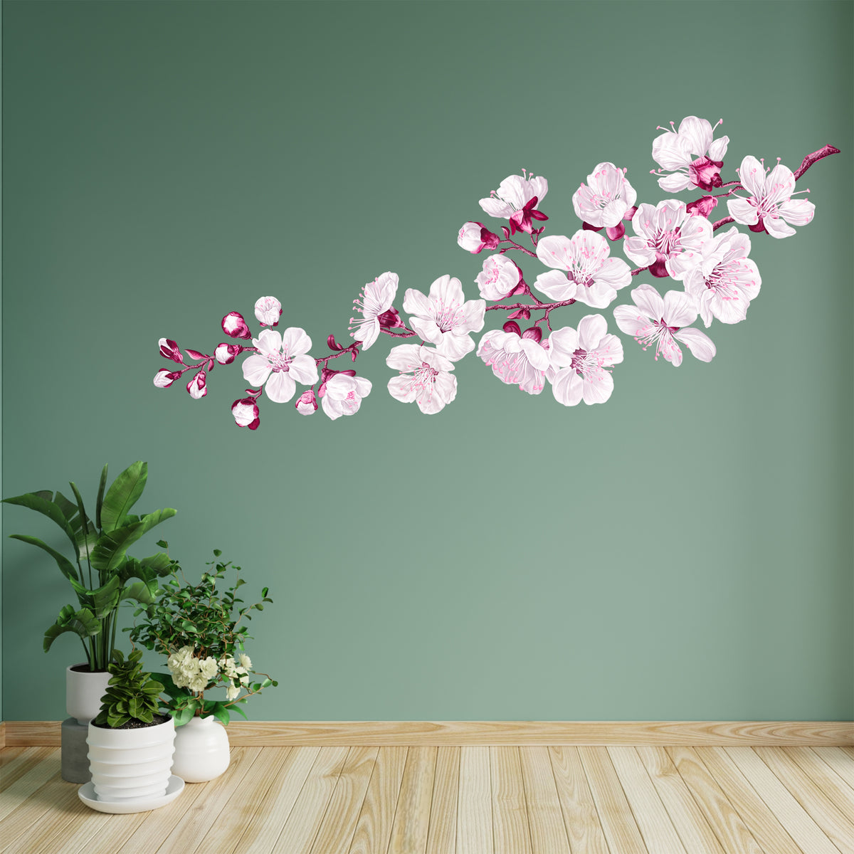 Wandtattoo mit weißen Kirschblüten an grüner Wand