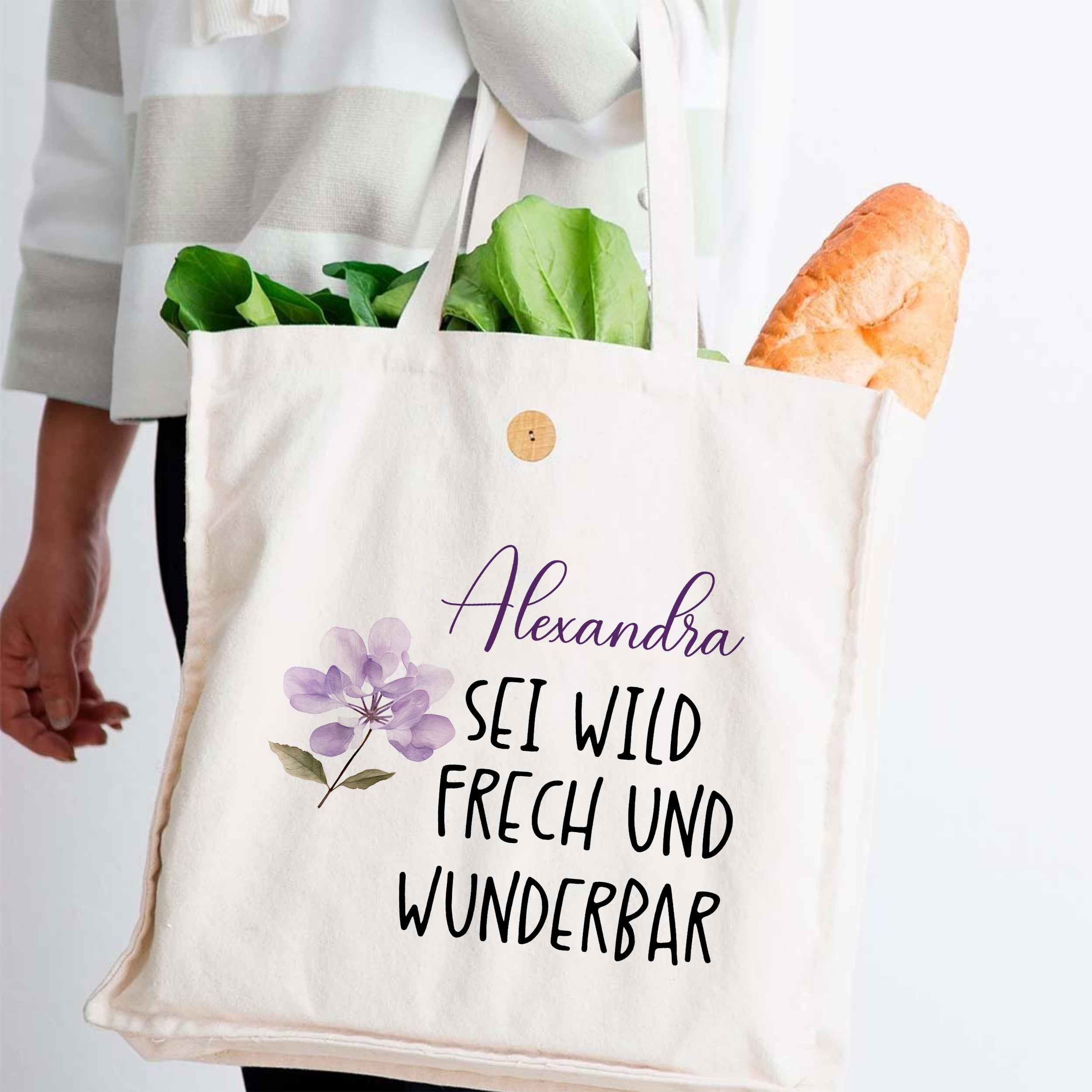Beige Baumwolltasche mit floralem Design und Spruch.