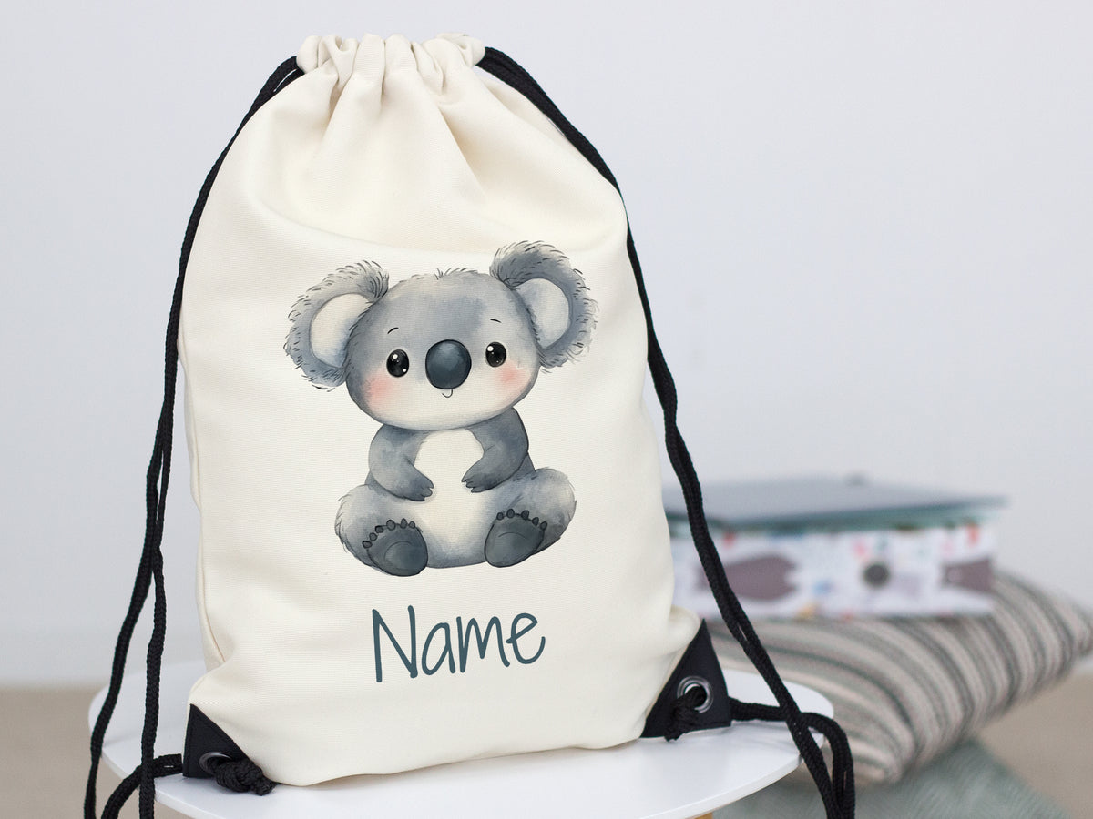 Beiger Turnbeutel mit Koala-Motiv und personalisierbarem Namen.