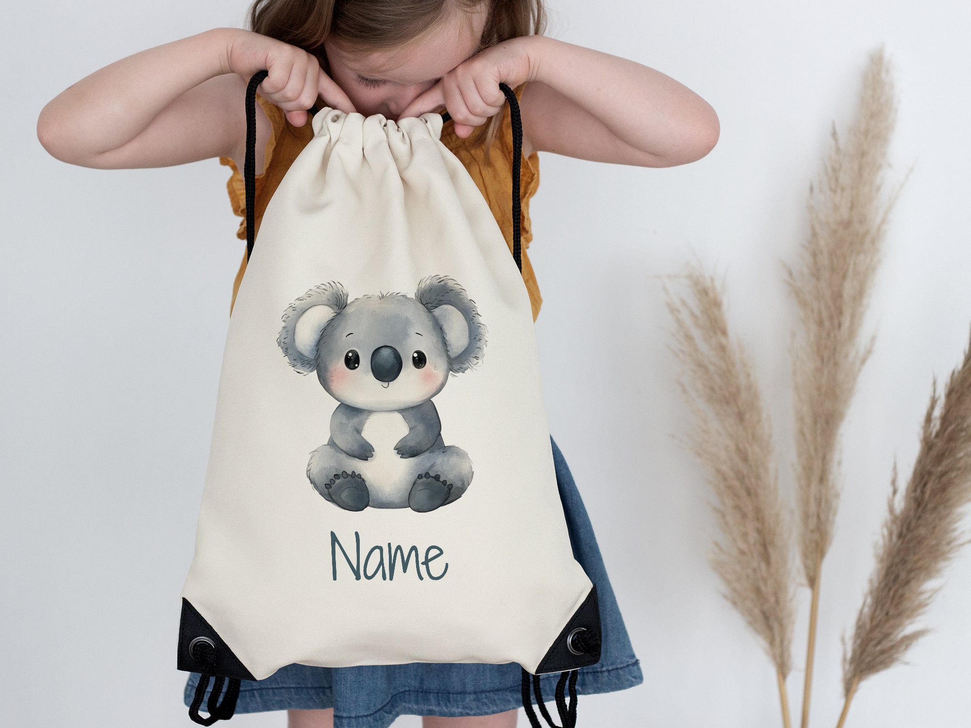 Kuscheliger Koala-Rucksack in Creme mit personalisierbarem Namen.