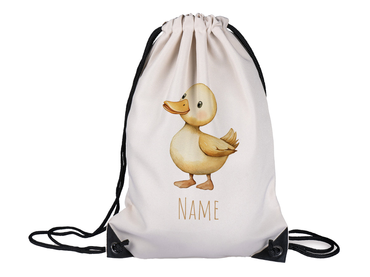 Beige Turnbeutel mit Entenmotiv und personalisierbarem Namen.