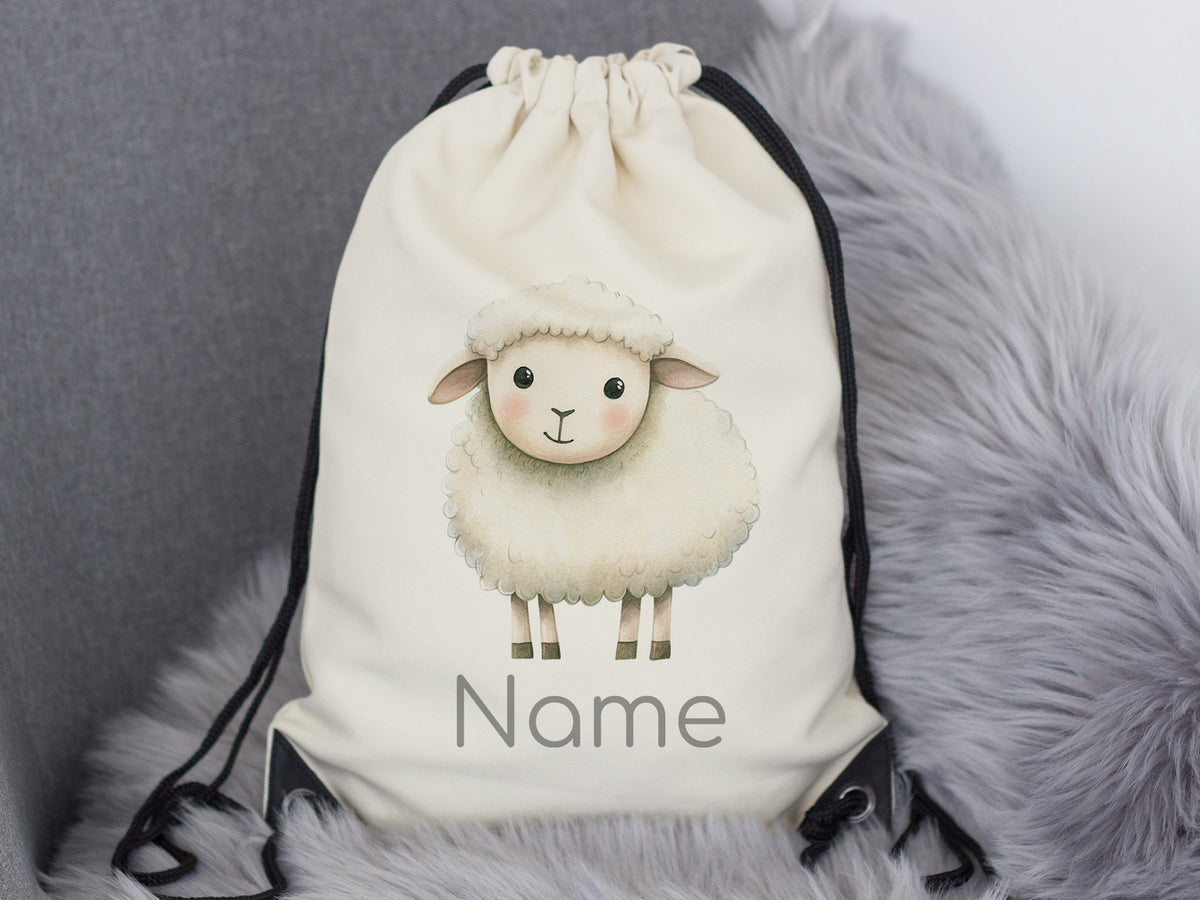 Beige Rucksack mit niedlichem Schaf und personalisiertem Namen.