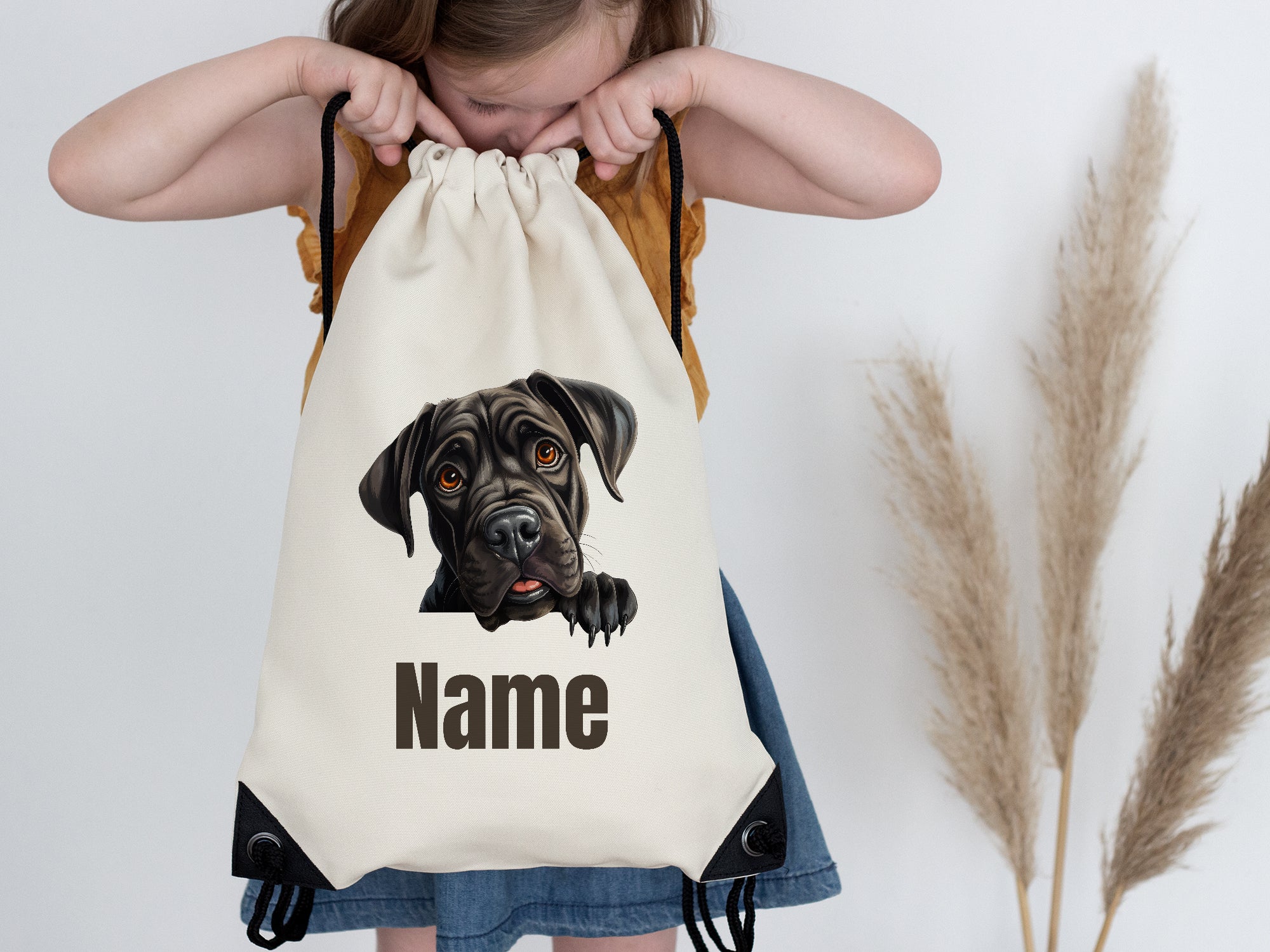 Beige Turnbeutel mit Hundemotiv und personalisierbarem Namen.
