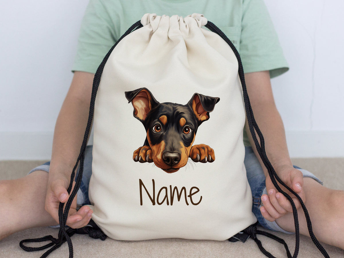 Beige Rucksack mit Hundemotiv und personalisierbarem Namen.