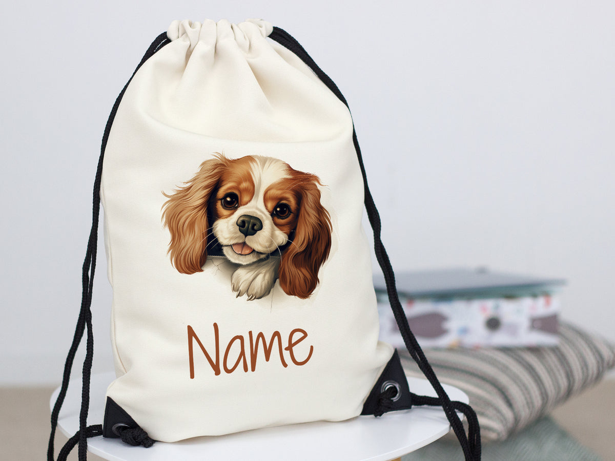 Beige Turnbeutel mit Hundemotiv und personalisierbarem Namen.