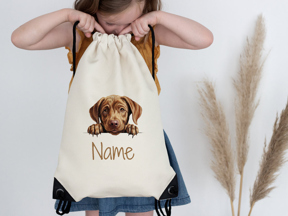Beige Rucksack mit Hundemotiv und personalisierbarem Namen.