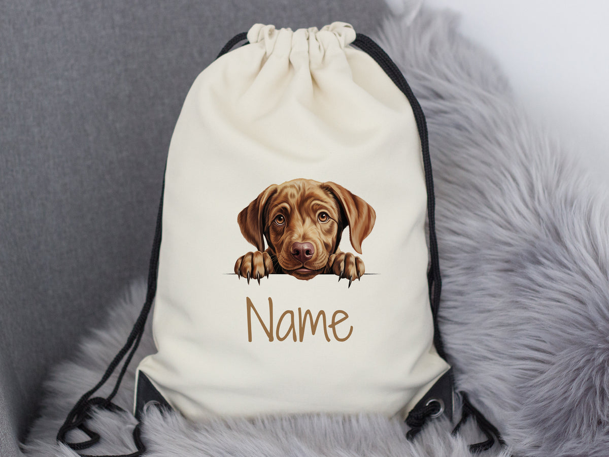 Beige Turnbeutel mit Hundemotiv und personalisierbarem Namen.