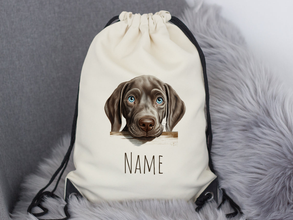 Beige Rucksack mit Hundemotiv und personalisierbarem Namen.