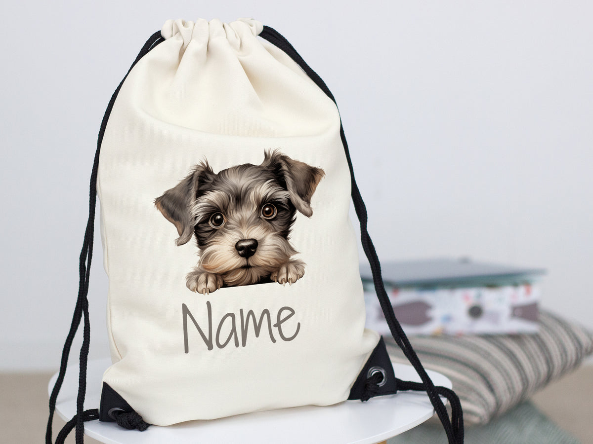 Beige Rucksack mit Hundemotiv und personalisiertem Namen.