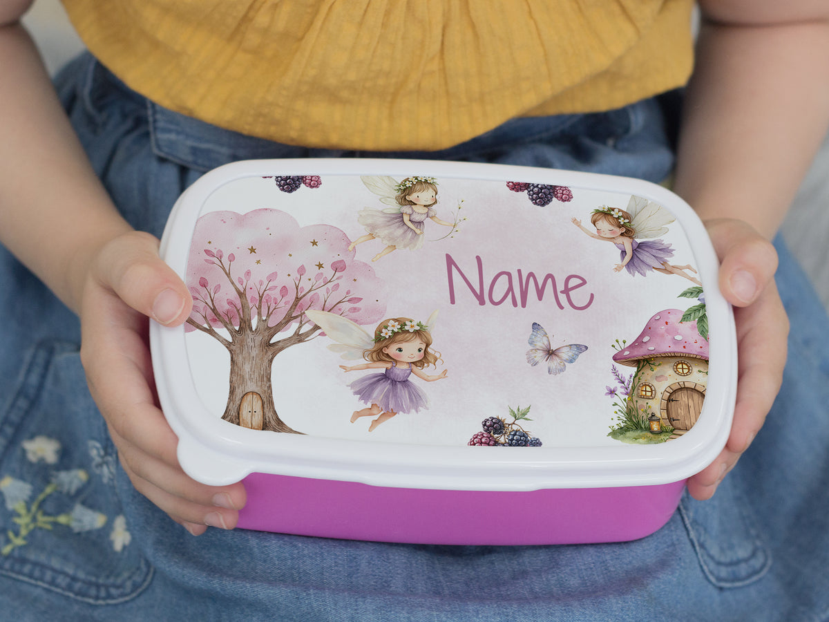 Bunte Brotdose mit Feenmotiven und personalisiertem Namen.