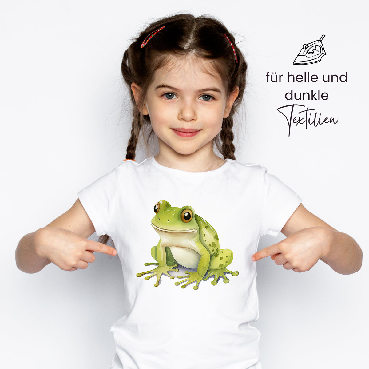 Weißes T-Shirt mit grünem Frosch-Motiv, kindgerecht.